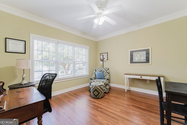 office space featuring ceiling fan, crown molding, and light hardwood / wood-style floors