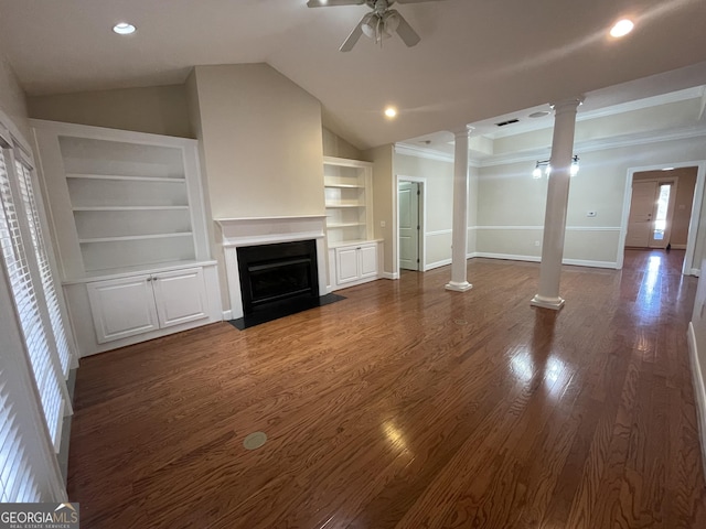 unfurnished living room featuring lofted ceiling, decorative columns, ceiling fan, dark wood-type flooring, and built in features