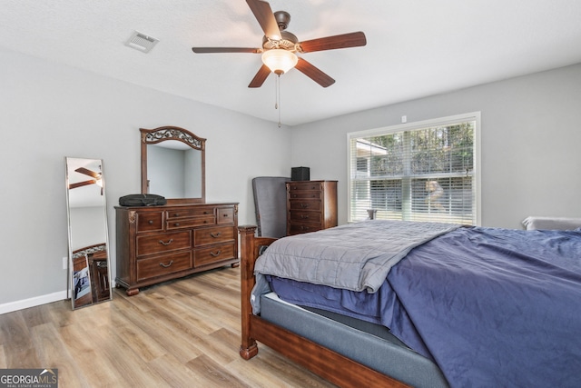 bedroom featuring light wood-type flooring and ceiling fan