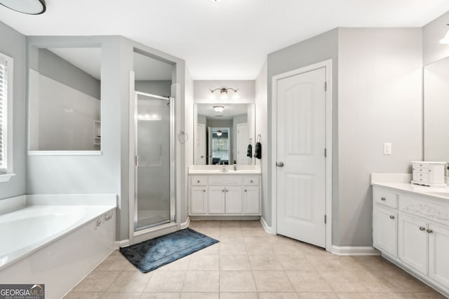 bathroom featuring tile patterned floors, separate shower and tub, and vanity