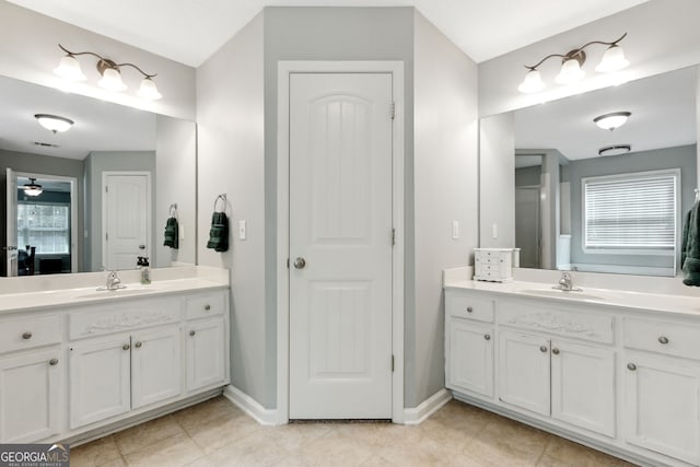 bathroom featuring tile patterned floors, vanity, and ceiling fan