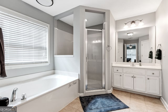 bathroom featuring separate shower and tub, tile patterned flooring, and vanity