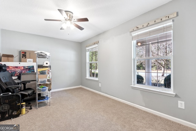 office area with carpet flooring and ceiling fan