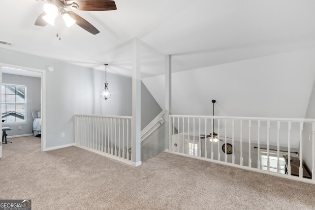 unfurnished room with carpet floors and ceiling fan