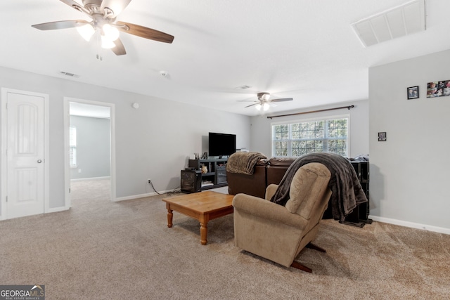 living room with light carpet and ceiling fan