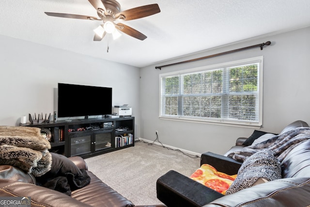 living room with carpet, a textured ceiling, and ceiling fan