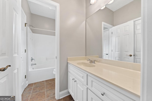 full bathroom with toilet, shower / bathing tub combination, tile patterned flooring, and vanity