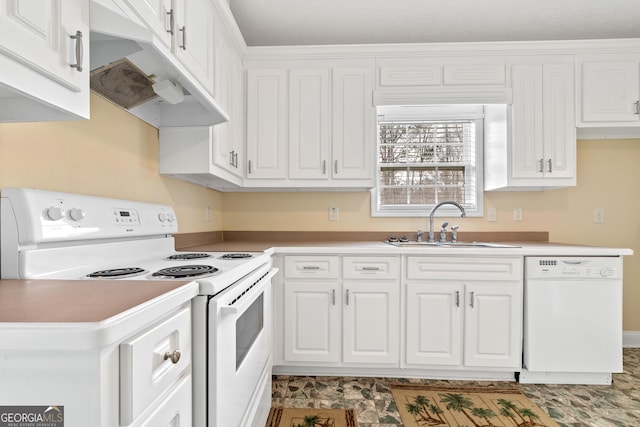 kitchen with sink, white appliances, and white cabinets