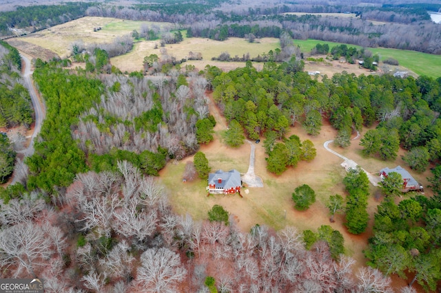 birds eye view of property with a rural view