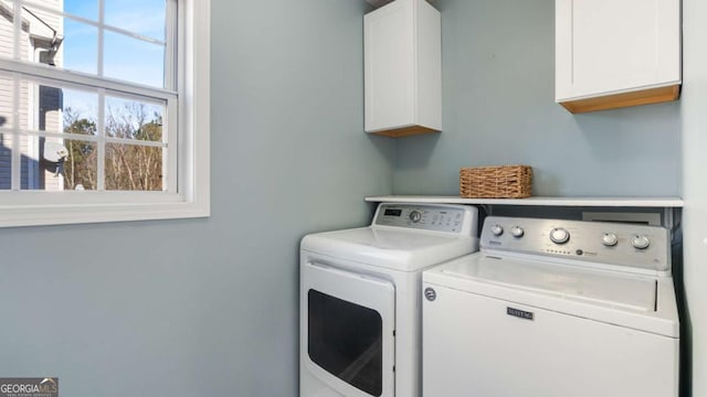 laundry area featuring cabinet space and washing machine and dryer