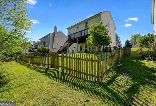 view of yard featuring stairway, a wooden deck, and fence private yard