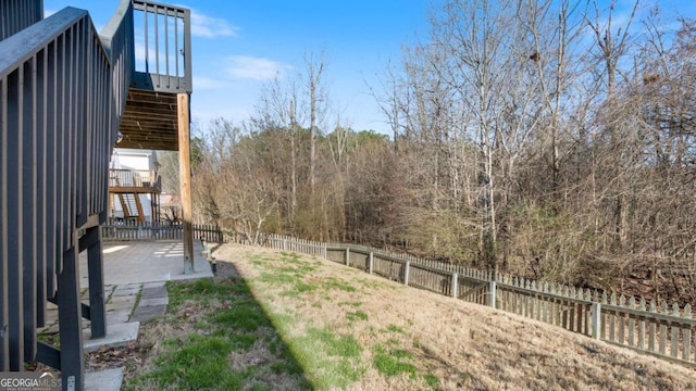 view of yard featuring a patio and fence