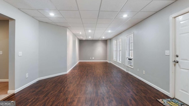 interior space with recessed lighting, wood finished floors, baseboards, and a drop ceiling