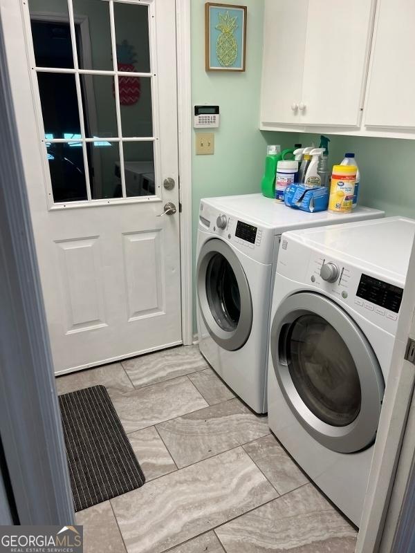 11 Plantation Dr, Swainsboro, GA 30401 - laundry area featuring washer and clothes dryer and cabinet space