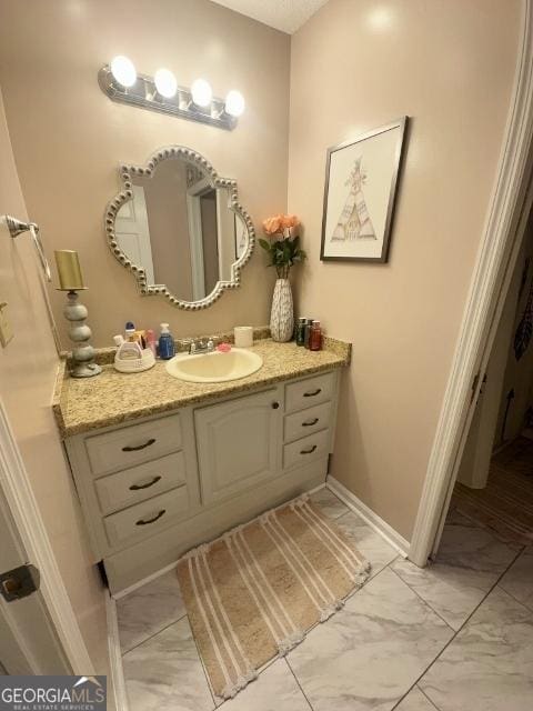 11 Plantation Dr, Swainsboro, GA 30401 - bathroom with marble finish floor, vanity, and baseboards