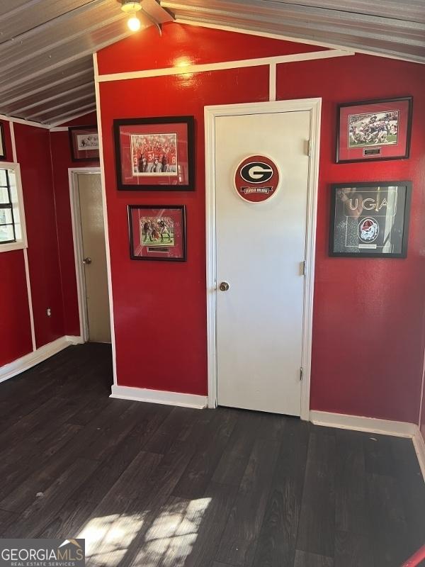 11 Plantation Dr, Swainsboro, GA 30401 - interior space with lofted ceiling, dark wood-style flooring, and baseboards