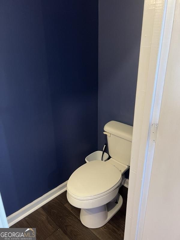 11 Plantation Dr, Swainsboro, GA 30401 - bathroom with toilet, baseboards, and wood finished floors