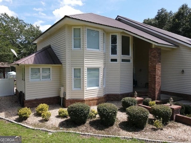 11 Plantation Dr, Swainsboro, GA 30401 - back of property featuring metal roof