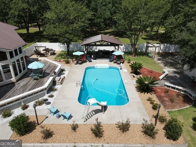 11 Plantation Dr, Swainsboro, GA 30401 - view of swimming pool with a fenced in pool, a patio, a fenced backyard, a deck, and a gazebo