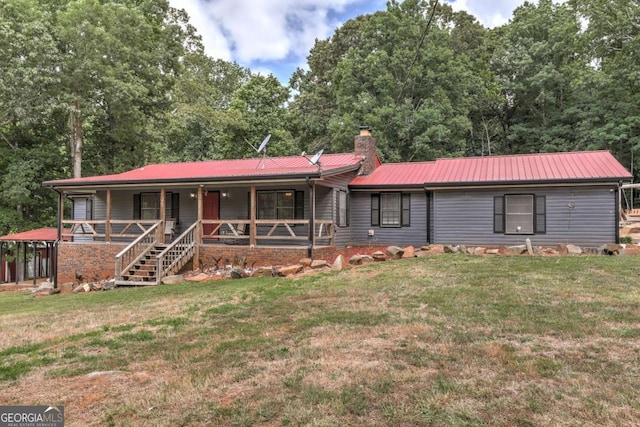 view of front of property with covered porch and a front lawn