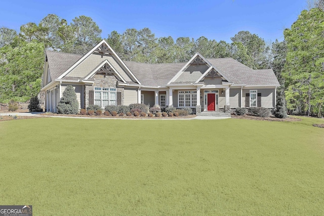 craftsman house featuring a front lawn