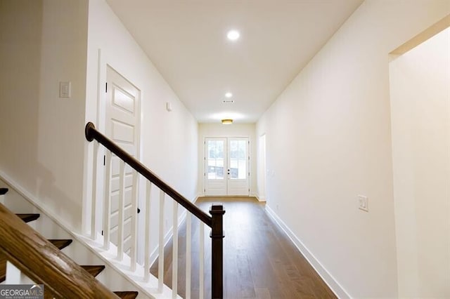 interior space with french doors and hardwood / wood-style floors