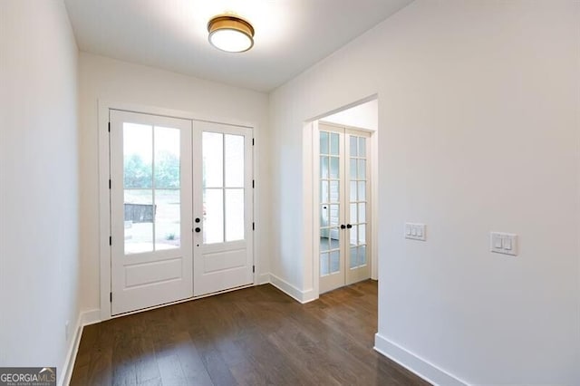 doorway to outside with dark hardwood / wood-style flooring and french doors