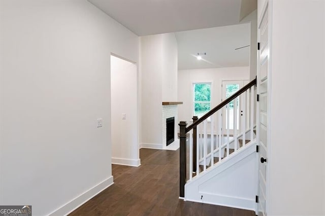 hall with dark hardwood / wood-style flooring