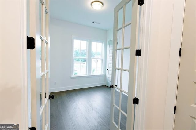 interior space with french doors and dark wood-type flooring