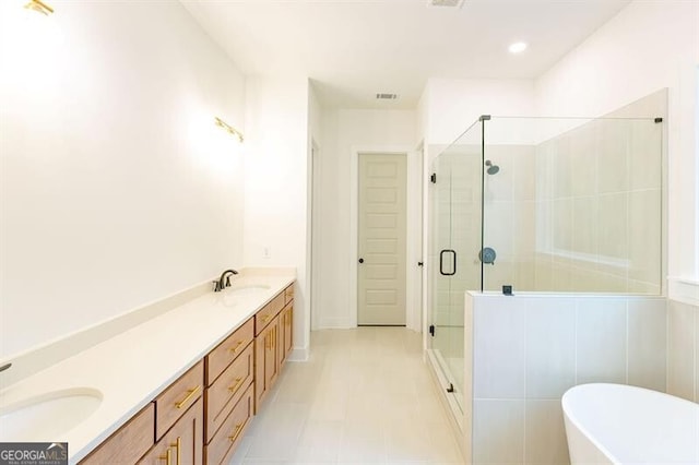 bathroom with separate shower and tub and vanity