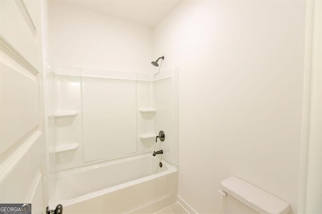 bathroom with toilet and shower / washtub combination