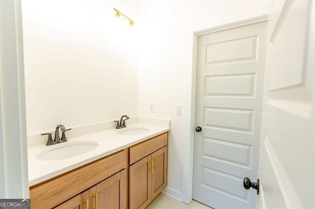 bathroom featuring tile patterned floors and vanity