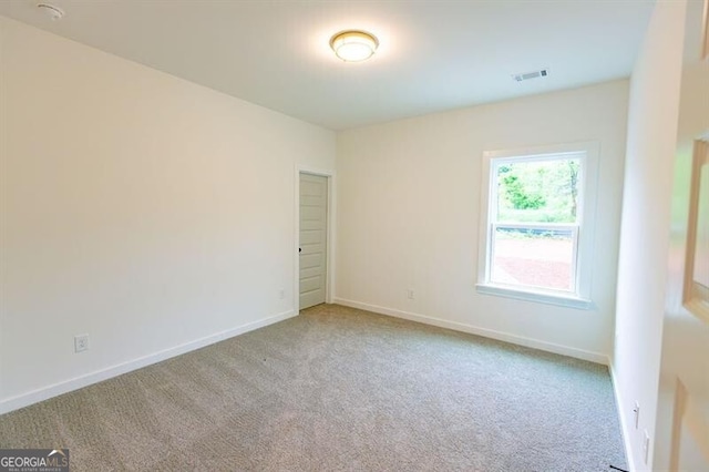 view of carpeted spare room