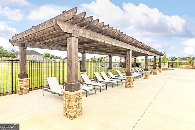 view of patio / terrace with fence and a pergola