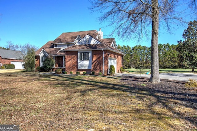 view of front of property with a front lawn and a garage