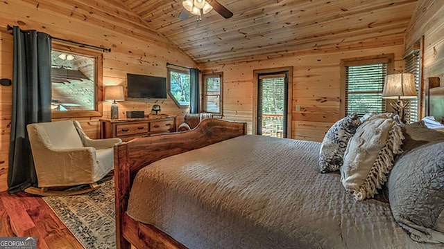 bedroom with wood ceiling, wood walls, and lofted ceiling