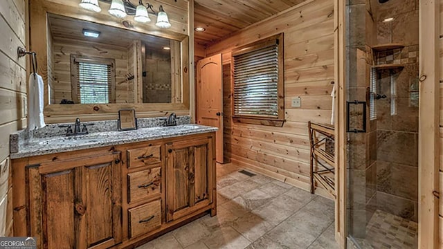 bathroom with an enclosed shower, vanity, wooden ceiling, and wood walls