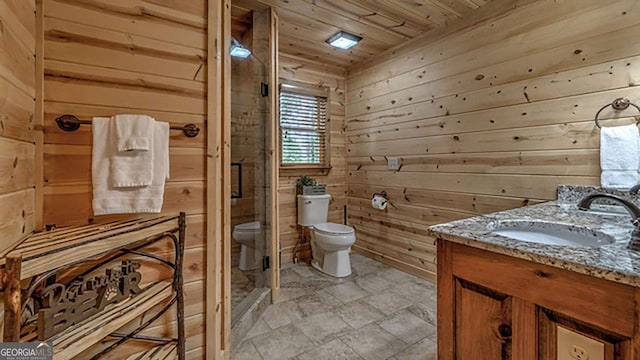 bathroom with toilet, wooden walls, a shower with door, wood ceiling, and vanity