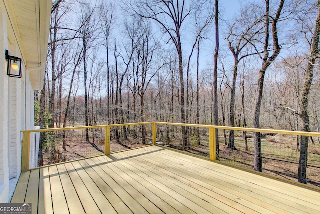 deck featuring a forest view