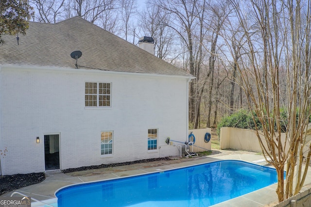 view of pool featuring a fenced in pool and fence