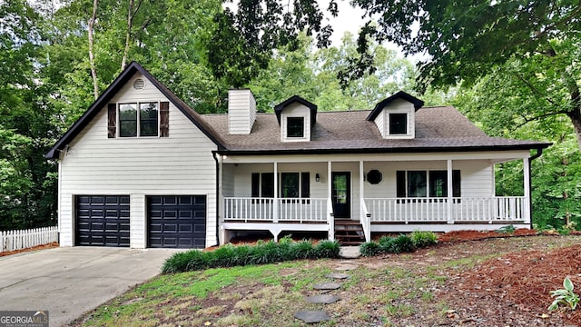 view of front of house featuring covered porch and a garage