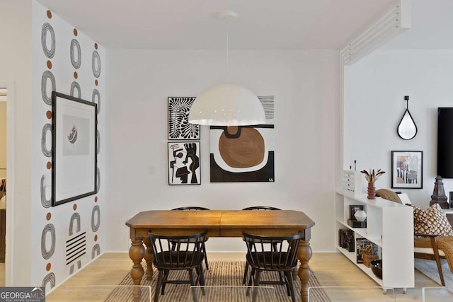 dining room featuring light wood finished floors