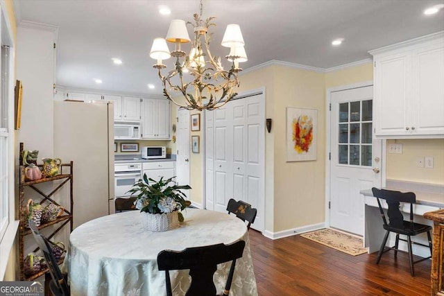 dining room with a chandelier, crown molding, and dark hardwood / wood-style floors