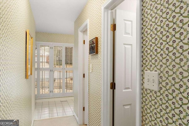 hallway with light tile patterned floors