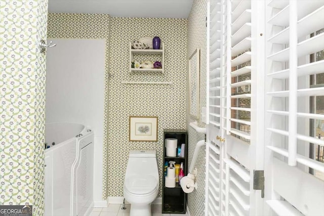 interior space with tile patterned flooring and toilet