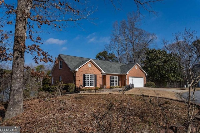 single story home featuring a garage