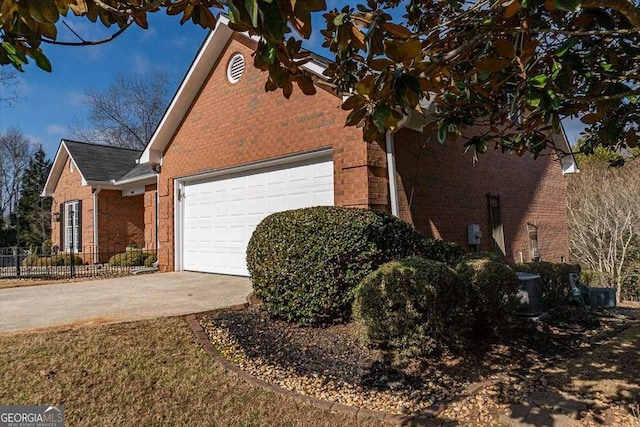 view of property exterior with a garage