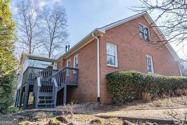 view of side of property with a wooden deck