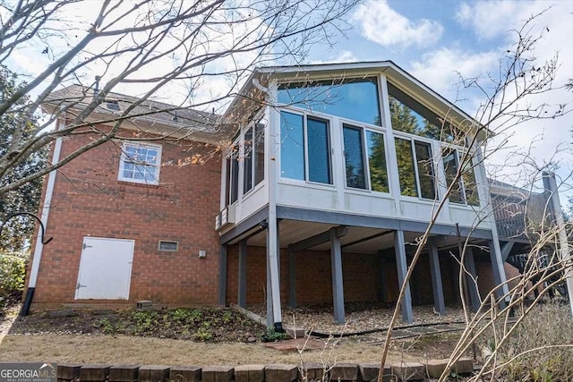 view of side of home with a sunroom