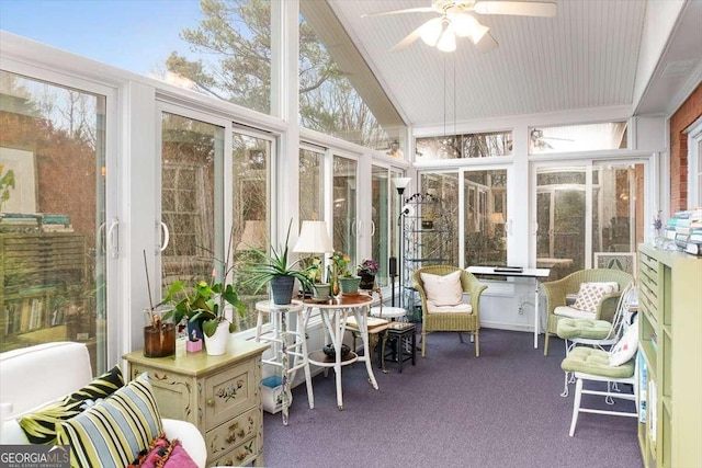 sunroom featuring lofted ceiling and ceiling fan